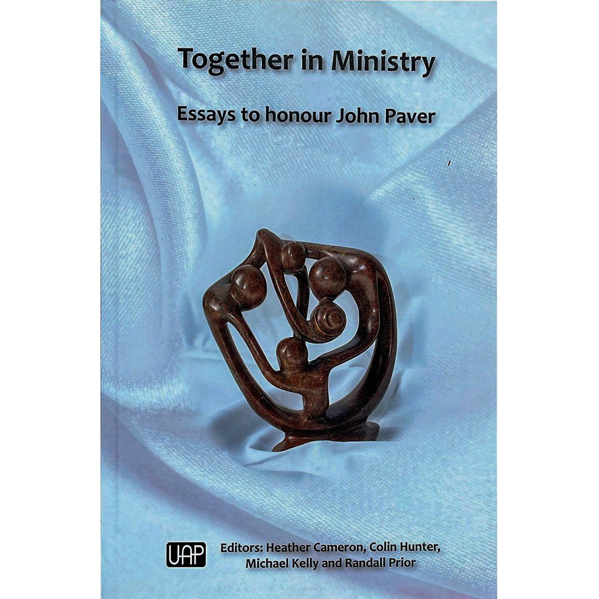 Together in Ministry book cover with an abstract sculpture on blue fabric